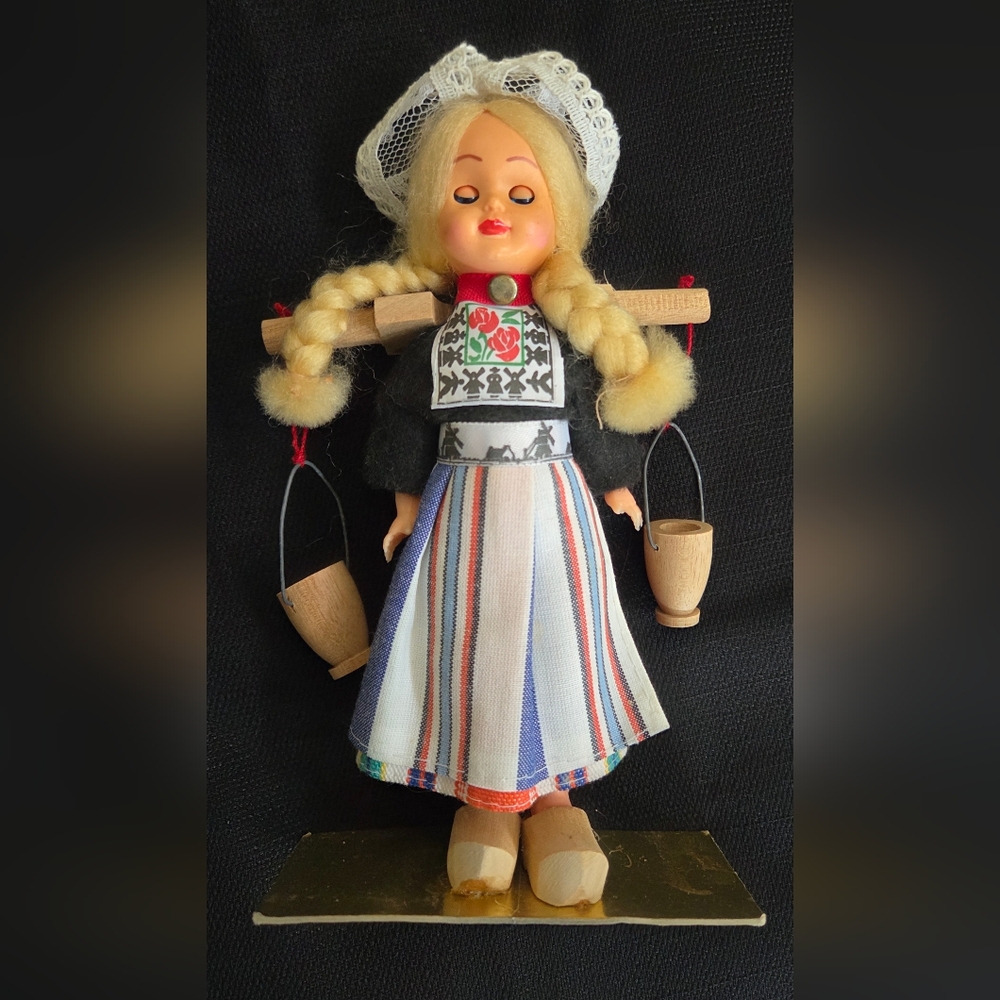 Traditional Doll with Braided Hair and Wooden Buckets